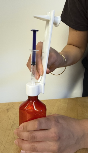 ENdose in use on a medicine bottle (photo)