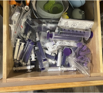 Parent-caregiver's disorganized kitchen 'pharmacy' drawer